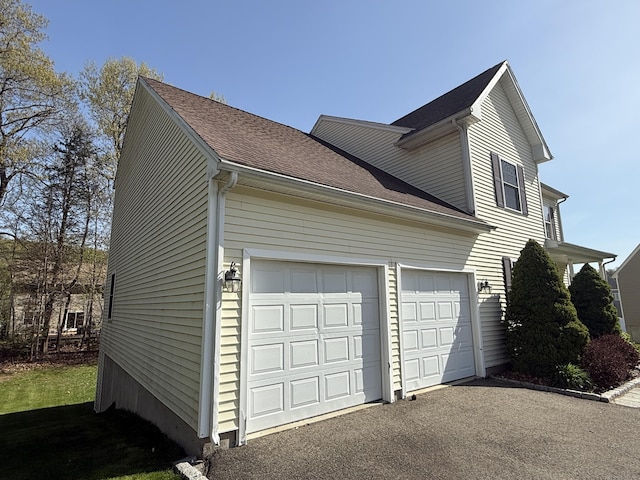 123 Hidden Valley Dr, Meriden, CT 06451 - view of side of property with an attached garage, driveway, and roof with shingles
