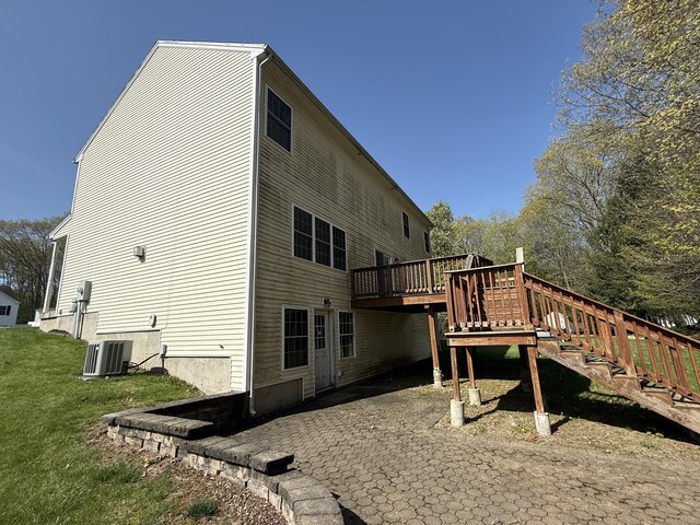 123 Hidden Valley Dr, Meriden, CT 06451 - rear view of property with a yard, central AC, a wooden deck, and a patio area