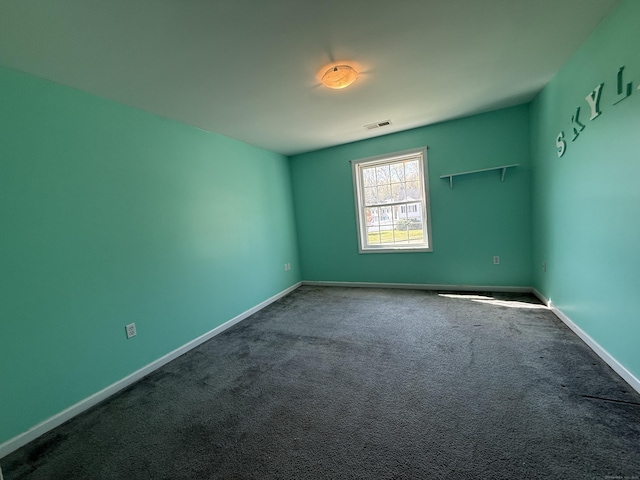 123 Hidden Valley Dr, Meriden, CT 06451 - spare room with baseboards, dark carpet, and visible vents