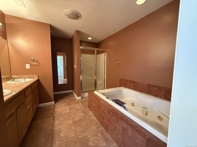 123 Hidden Valley Dr, Meriden, CT 06451 - full bathroom with a jetted tub, double vanity, a shower stall, a sink, and baseboards