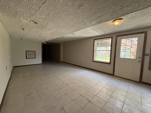 123 Hidden Valley Dr, Meriden, CT 06451 - interior space featuring baseboards, a textured ceiling, and light tile patterned floors