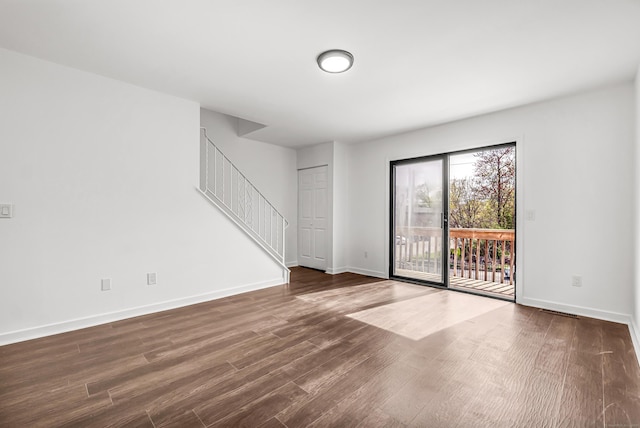 15 Crest St Unit D27, West Haven, CT 06516 - unfurnished living room featuring stairway, baseboards, visible vents, and dark wood-type flooring