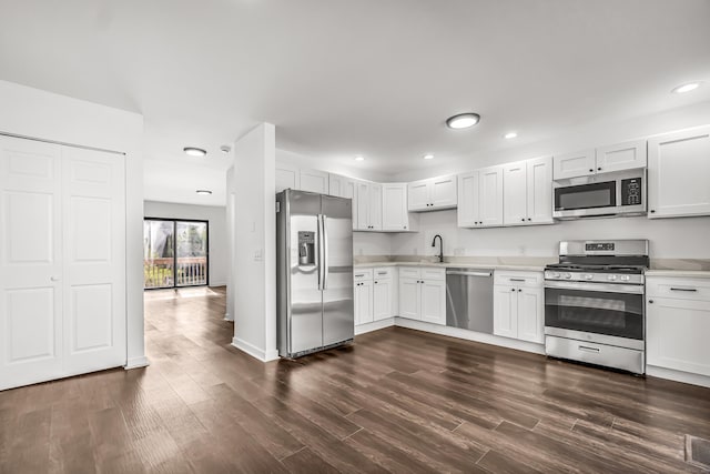 15 Crest St Unit D27, West Haven, CT 06516 - kitchen featuring recessed lighting, light countertops, dark wood-style flooring, and stainless steel appliances