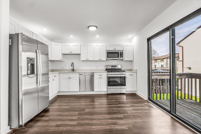 15 Crest St Unit D27, West Haven, CT 06516 - kitchen with light countertops, dark wood-style flooring, appliances with stainless steel finishes, and white cabinets