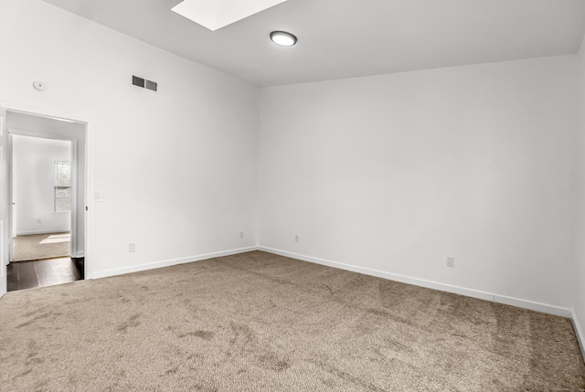 15 Crest St Unit D27, West Haven, CT 06516 - carpeted empty room with a skylight, baseboards, and visible vents