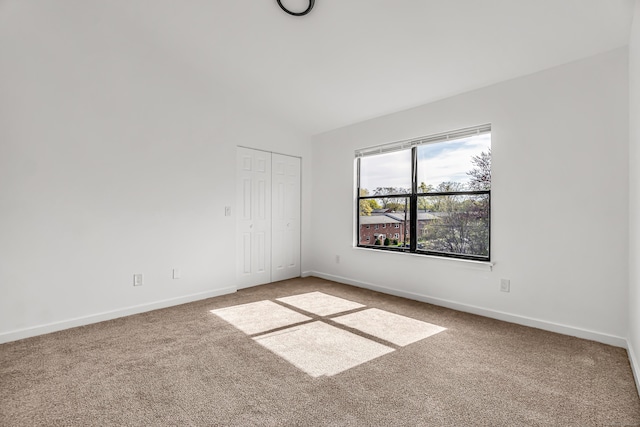 15 Crest St Unit D27, West Haven, CT 06516 - spare room with carpet floors, baseboards, and lofted ceiling