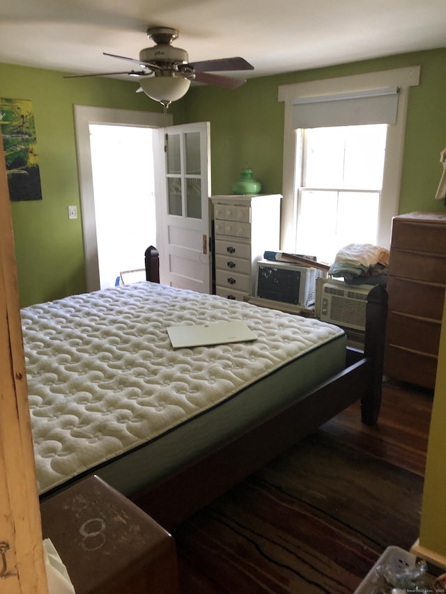 bedroom with ceiling fan and wood finished floors