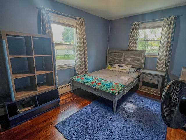 63 Ridgetop Rd, Wallingford, CT 06492 - bedroom with multiple windows, wood finished floors, and baseboard heating