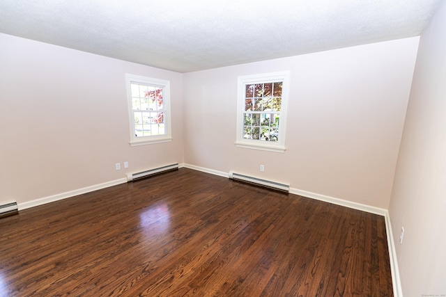 144 Fiesta Hts, Meriden, CT 06451 - empty room featuring a baseboard heating unit, dark wood-type flooring, and baseboards