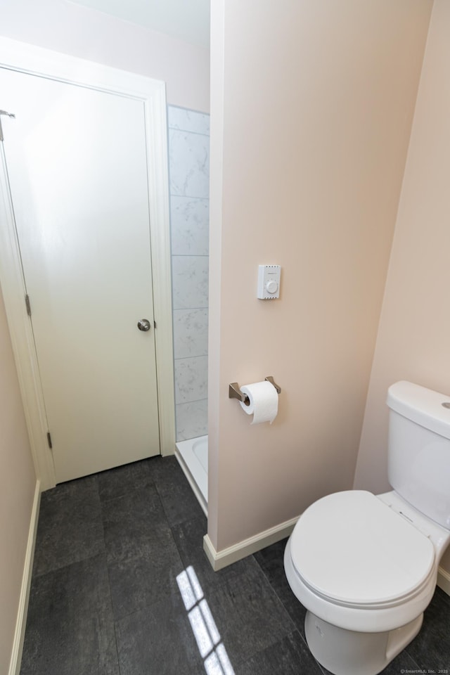 144 Fiesta Hts, Meriden, CT 06451 - bathroom featuring toilet, a shower stall, and baseboards