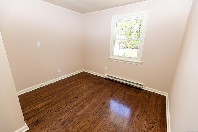 144 Fiesta Hts, Meriden, CT 06451 - empty room featuring a baseboard heating unit, dark wood-type flooring, baseboards, and ornamental molding