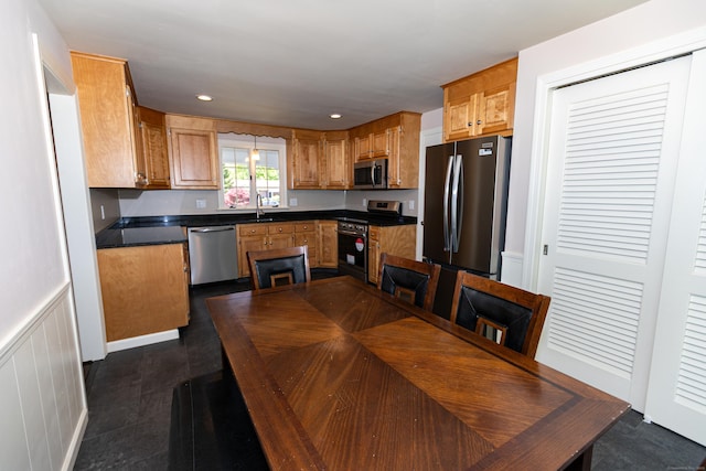 144 Fiesta Hts, Meriden, CT 06451 - kitchen with stainless steel appliances, dark countertops, brown cabinetry, recessed lighting, and a sink