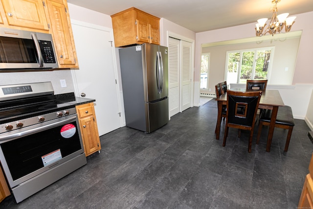 144 Fiesta Hts, Meriden, CT 06451 - kitchen with appliances with stainless steel finishes, a chandelier, baseboard heating, dark countertops, and hanging light fixtures