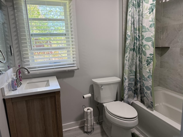 full bathroom featuring vanity, shower / tub combo with curtain, toilet, baseboards, and wood finished floors
