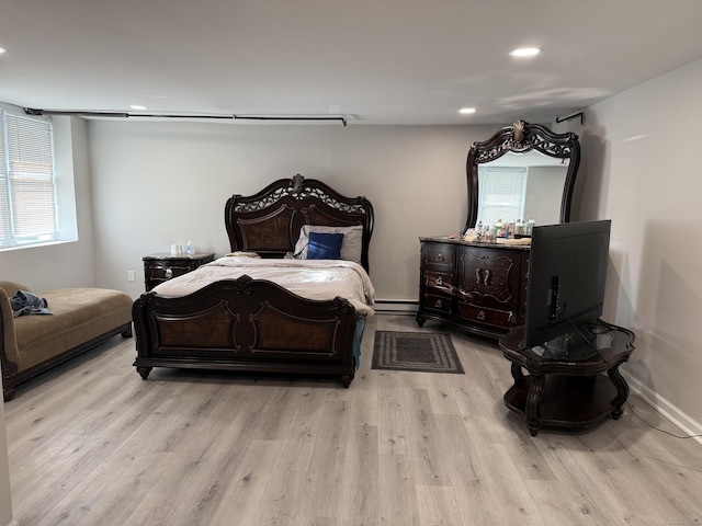 bedroom featuring recessed lighting, multiple windows, and light wood-type flooring