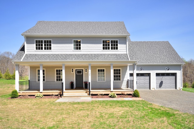 view of front facade featuring roof with shingles, covered porch, and a front lawn