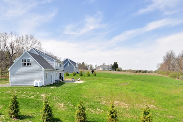 view of yard with a patio and central AC