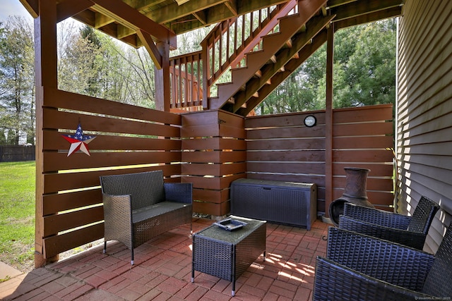 104 S St, Morris, CT 06763 - view of patio with an outdoor hangout area, stairway, and fence