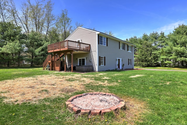 104 S St, Morris, CT 06763 - back of property featuring a yard, stairs, a wooden deck, and a hot tub