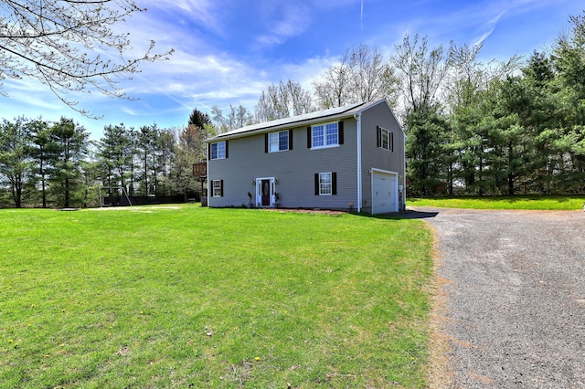 104 S St, Morris, CT 06763 - colonial inspired home featuring an attached garage, a front lawn, and driveway
