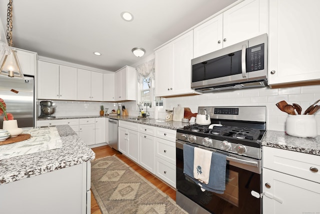 26 Greenwood Dr, Prospect, CT 06712 - kitchen with a sink, appliances with stainless steel finishes, and white cabinets