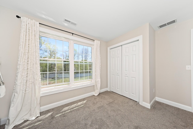 26 Greenwood Dr, Prospect, CT 06712 - unfurnished bedroom featuring visible vents, carpet, baseboards, and a closet