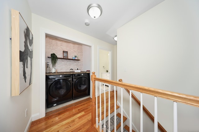 26 Greenwood Dr, Prospect, CT 06712 - hall with separate washer and dryer, baseboards, an upstairs landing, and light wood-type flooring