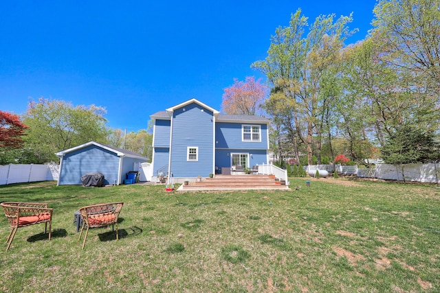 26 Greenwood Dr, Prospect, CT 06712 - rear view of property with a lawn, a deck, a fenced backyard, and an outdoor fire pit