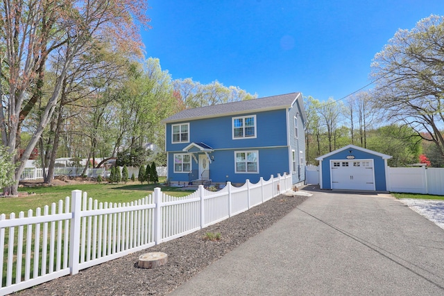 26 Greenwood Dr, Prospect, CT 06712 - view of front of house with a detached garage, driveway, a fenced front yard, and an outdoor structure