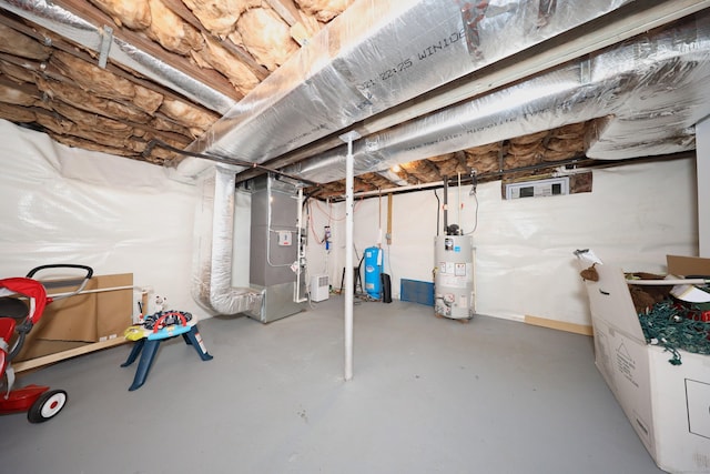 26 Greenwood Dr, Prospect, CT 06712 - unfinished basement featuring heating unit and gas water heater