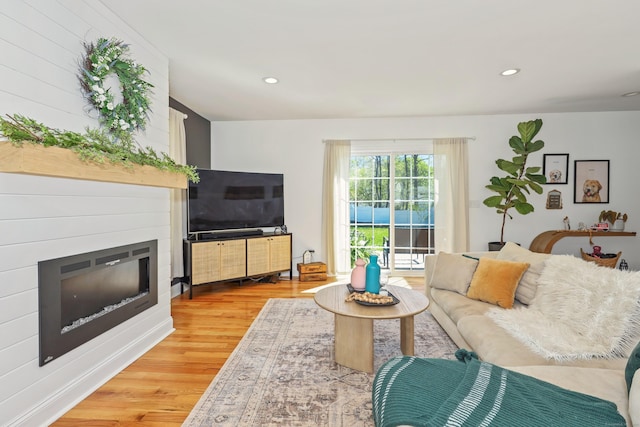 26 Greenwood Dr, Prospect, CT 06712 - living area with recessed lighting, a glass covered fireplace, and wood finished floors