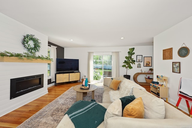 26 Greenwood Dr, Prospect, CT 06712 - living room with recessed lighting, baseboards, a glass covered fireplace, and wood finished floors