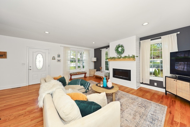 26 Greenwood Dr, Prospect, CT 06712 - living room with baseboards, a large fireplace, a wealth of natural light, and wood finished floors