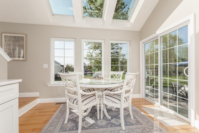 sunroom / solarium with visible vents and a skylight
