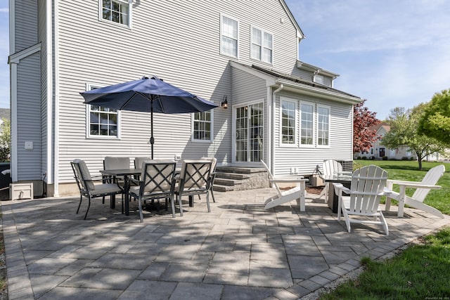 view of patio / terrace featuring outdoor dining space and entry steps
