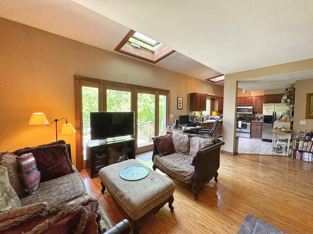 10 Ells St, Norwalk, CT 06850 - living room with a skylight and light wood-style floors
