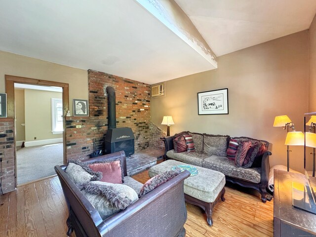 10 Ells St, Norwalk, CT 06850 - living room with wood finished floors and a wood stove