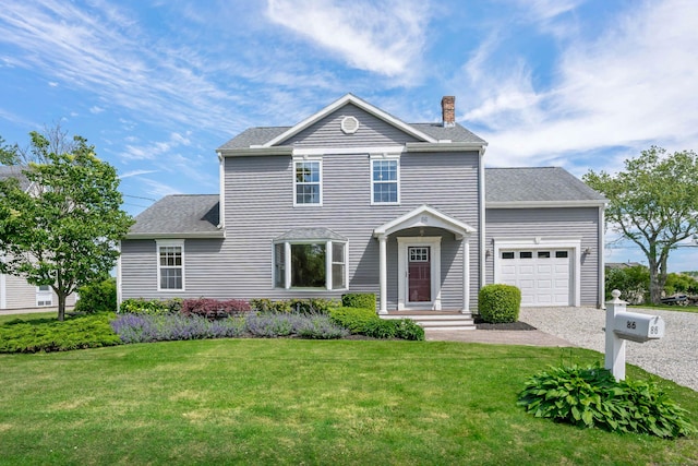 view of front of house featuring a chimney, roof with shingles, a front yard, gravel driveway, and an attached garage