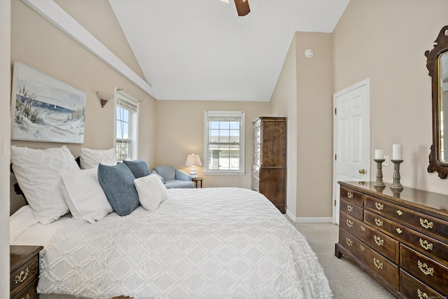 bedroom featuring light colored carpet, a ceiling fan, baseboards, and multiple windows