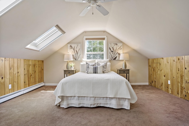 bedroom with baseboards, a baseboard radiator, wooden walls, and carpet flooring