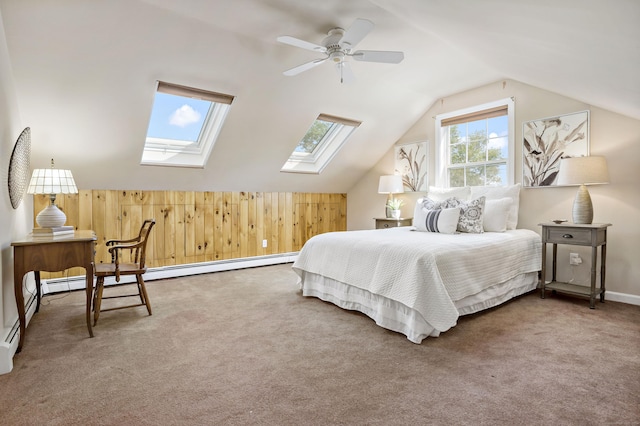 carpeted bedroom with ceiling fan and lofted ceiling with skylight