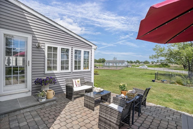 view of patio with fence and outdoor lounge area