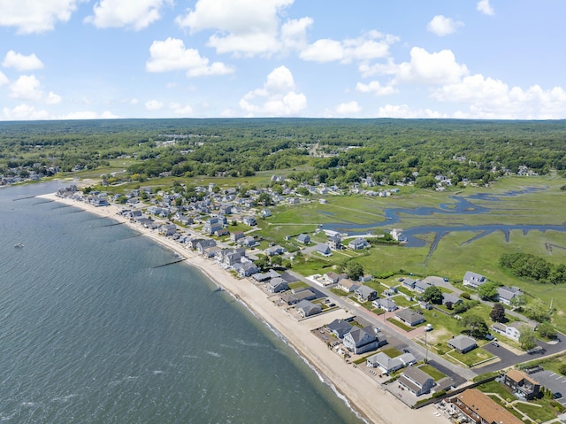 aerial view featuring a water view and a forest view