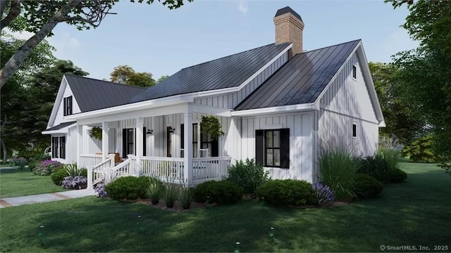 17A Old Stonington Rd, Stonington, CT 06378 - view of front of property with a standing seam roof, covered porch, metal roof, a front yard, and a chimney