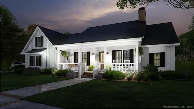 17A Old Stonington Rd, Stonington, CT 06378 - modern inspired farmhouse with board and batten siding, a porch, a chimney, metal roof, and a yard