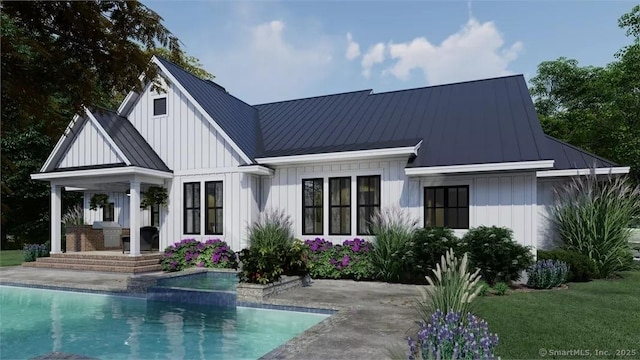17A Old Stonington Rd, Stonington, CT 06378 - back of house featuring a standing seam roof, board and batten siding, metal roof, an outdoor pool, and a patio