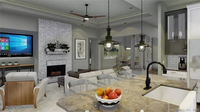 17A Old Stonington Rd, Stonington, CT 06378 - living room featuring ceiling fan, ornamental molding, a fireplace, and a tray ceiling