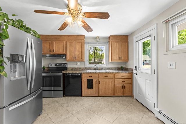 21 Roosevelt Blvd, Enfield, CT 06082 - kitchen with stainless steel appliances, under cabinet range hood, baseboard heating, a sink, and a ceiling fan