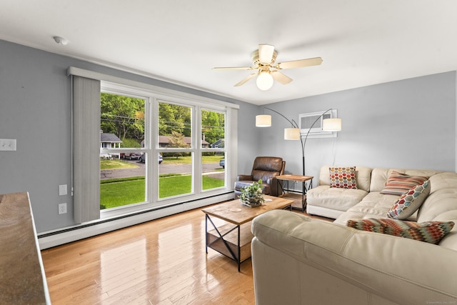 21 Roosevelt Blvd, Enfield, CT 06082 - living room featuring a baseboard heating unit, a wall mounted air conditioner, a ceiling fan, and wood finished floors