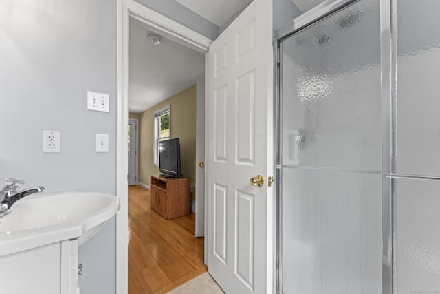 21 Roosevelt Blvd, Enfield, CT 06082 - bathroom with a shower stall, wood finished floors, and vanity
